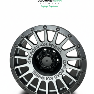 Journeyman Fitment gunmetal gray multi-spoke wheel with "OFF-ROAD 4X4 WHEEL" engraving and industrial bolt accents.