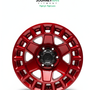 Journeyman Fitment metallic red off-road wheel with a heavy-duty grid-style outer pattern and 5-spoke center.