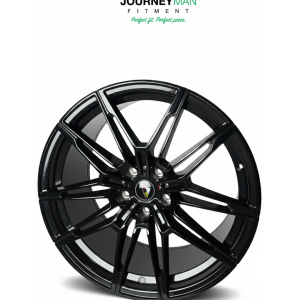 Matte black multi-spoke alloy car rim by Journeyman Fitment on a white background.